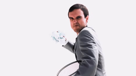 businessman throwing a paper ball in slow motion