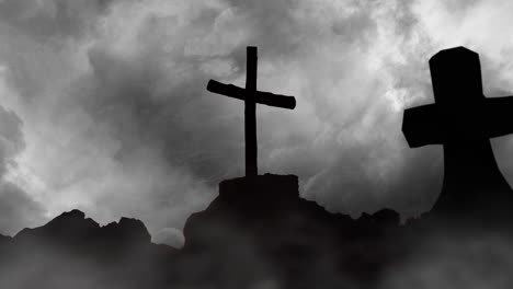 rocky hill with two silhouette crosses, dark clouds background