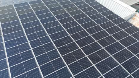 aerial: solar panels on the rooftop of raja haji fisabilillah mosque (cyberjaya mosque) during the day in cyberjaya, sepang, selangor, malaysia, flyover drone shot