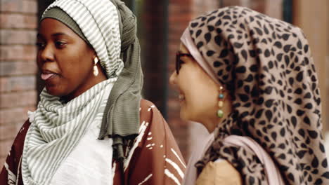 multiethnic women chatting outside building