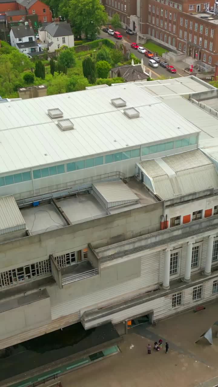Rising social ratio aerial video of Ulster Museum and Botanic Gardens in Belfast on a bright and sunny day. Filmed in 1080x1920, 60fps and with Rec709 color