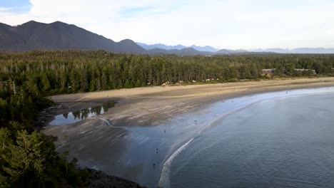 pan up of oceanside beach and mountains