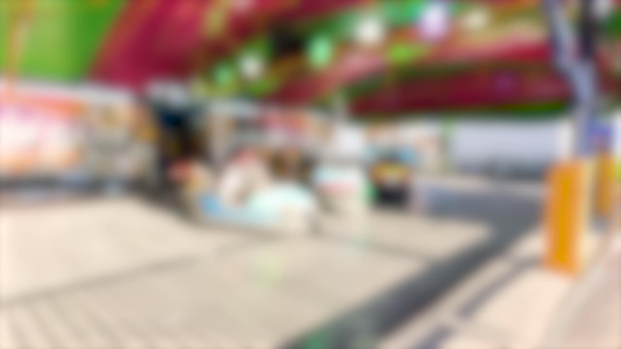 Bumper cars in a lively carnival setting with colorful lights and dynamic motion creating a fun, energetic atmosphere