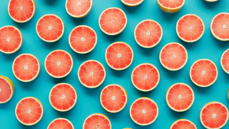 vibrant grapefruit halves pattern on blue background