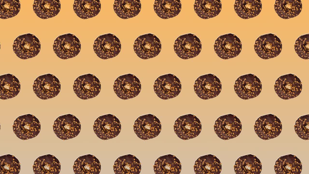 추상적인 다채로운 애니메이션 - 초콜릿과 카라멜을 가진 도이 노란색 그라디언트 배경에서 으로 움직입니다.