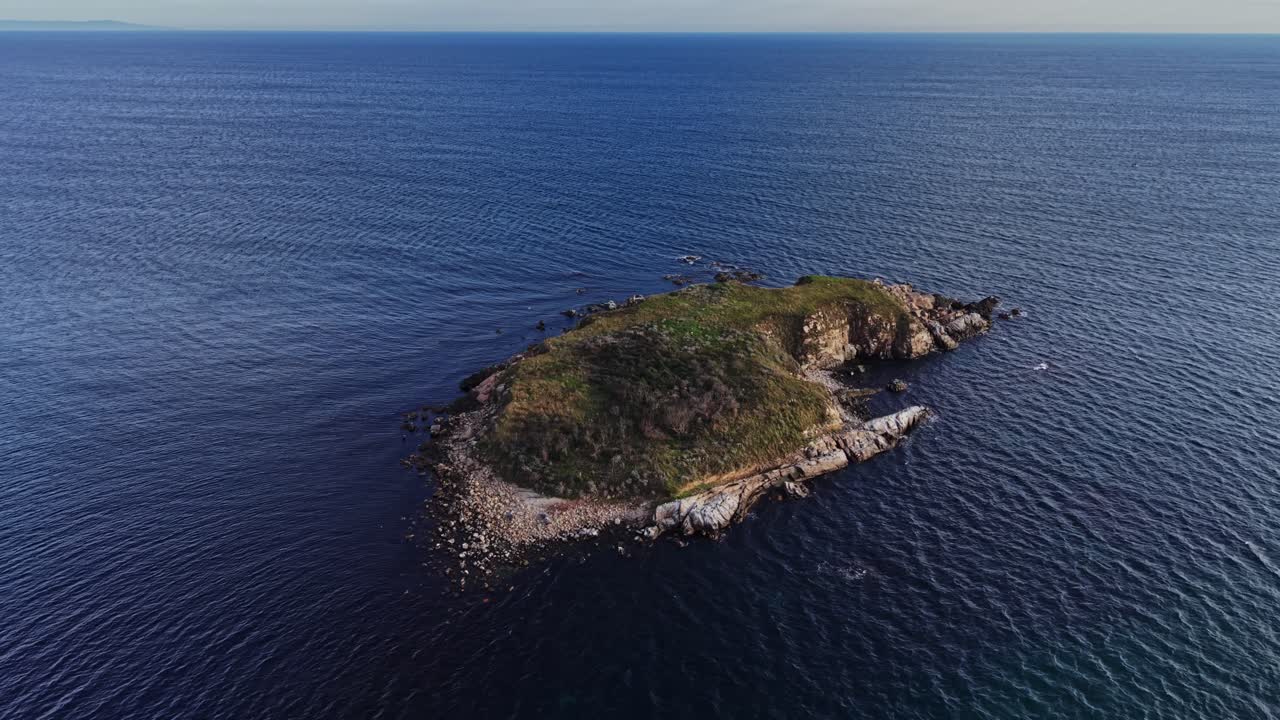 Aerial view of a small island in clear blue waters