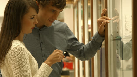 couple picking jewel in jewellery