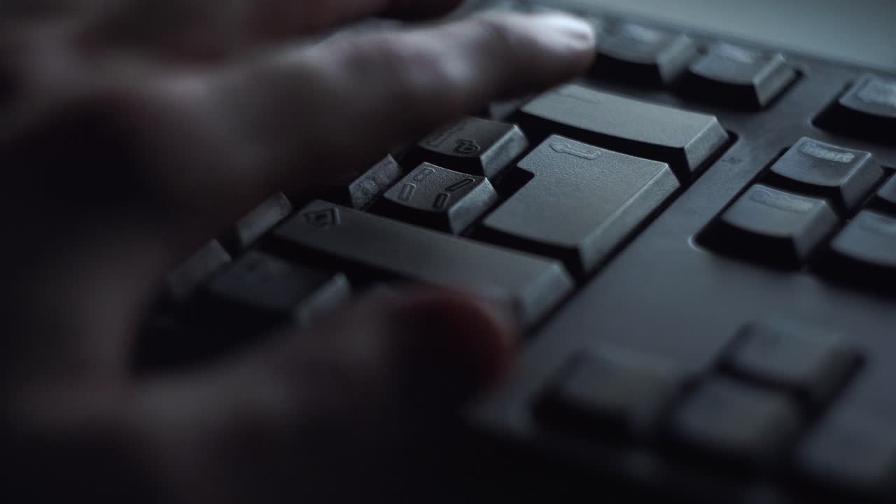 Person Typing on a Computer Keyboard