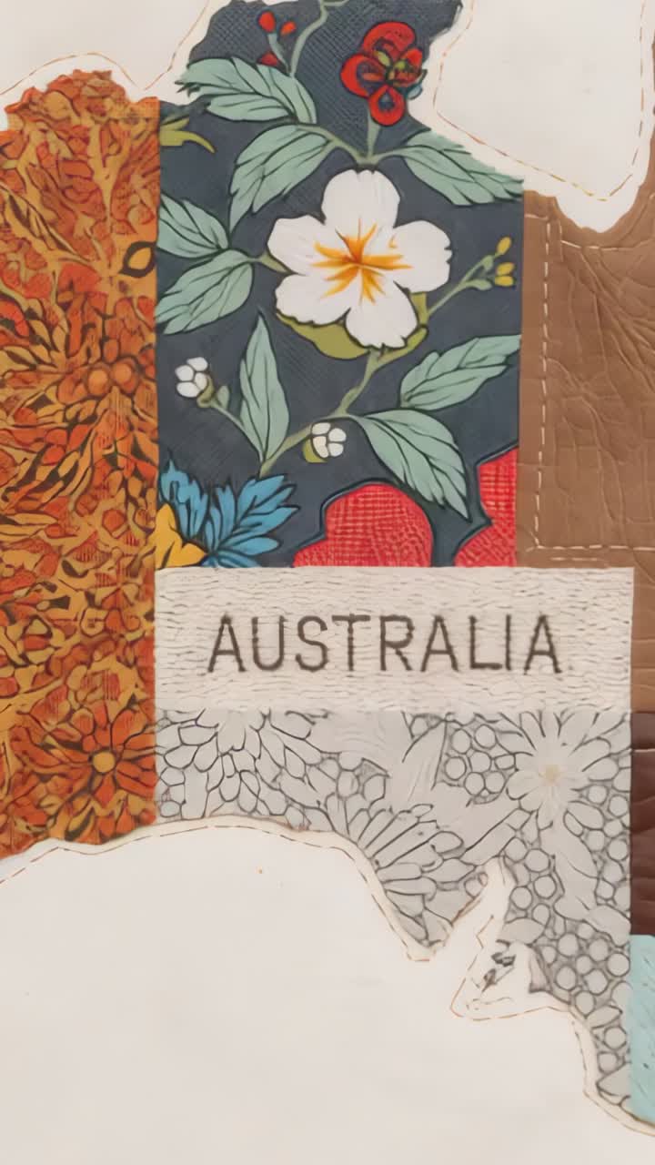 Vertical video: Camera adjusting focus on Australia map collage on tabletop showing AUSTRALIA label