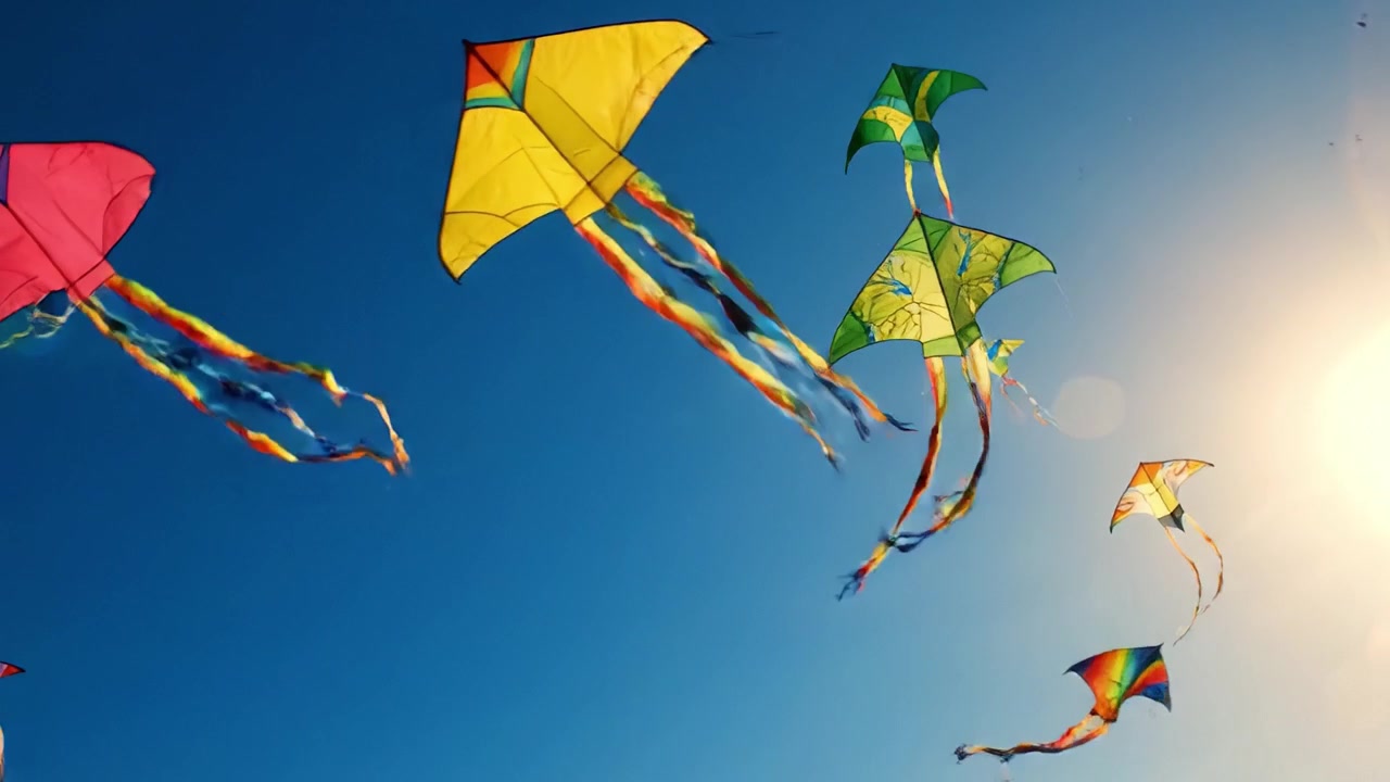 Uno spettacolo vivace di aquiloni colorati che danzano in un cielo azzurro limpido, catturando lo spirito gioioso del divertimento e dell'avventura all'aria aperta per tutte le età.