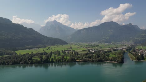 beautiful aerial view of the mountains seen from walensee lake, switzerland with blue sky