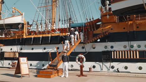 naval ship crew at the dock