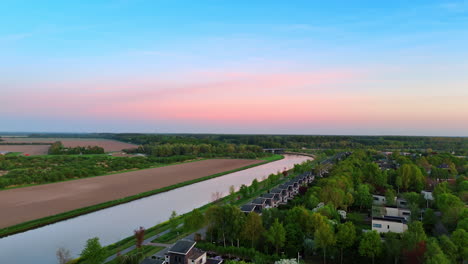 quick flight over the pond near the picturesque green village. sunset time in vinkeveen, the netherlands.