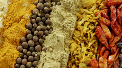 various spices arranged in row 4k