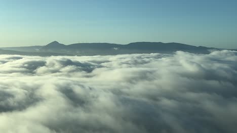 A-pilot’s-perspective-flying-over-the-fog-near-Pamplona,-Spain