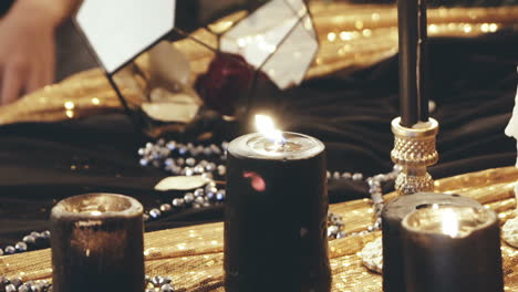 woman with candle. young witch woman casts a spell with candle in a room