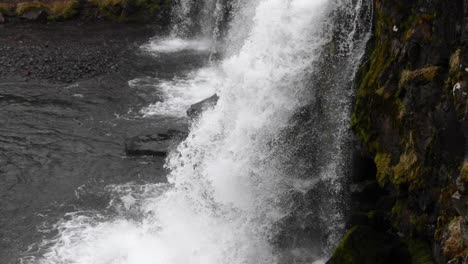 close up of a small iceland waterfall in slow motion