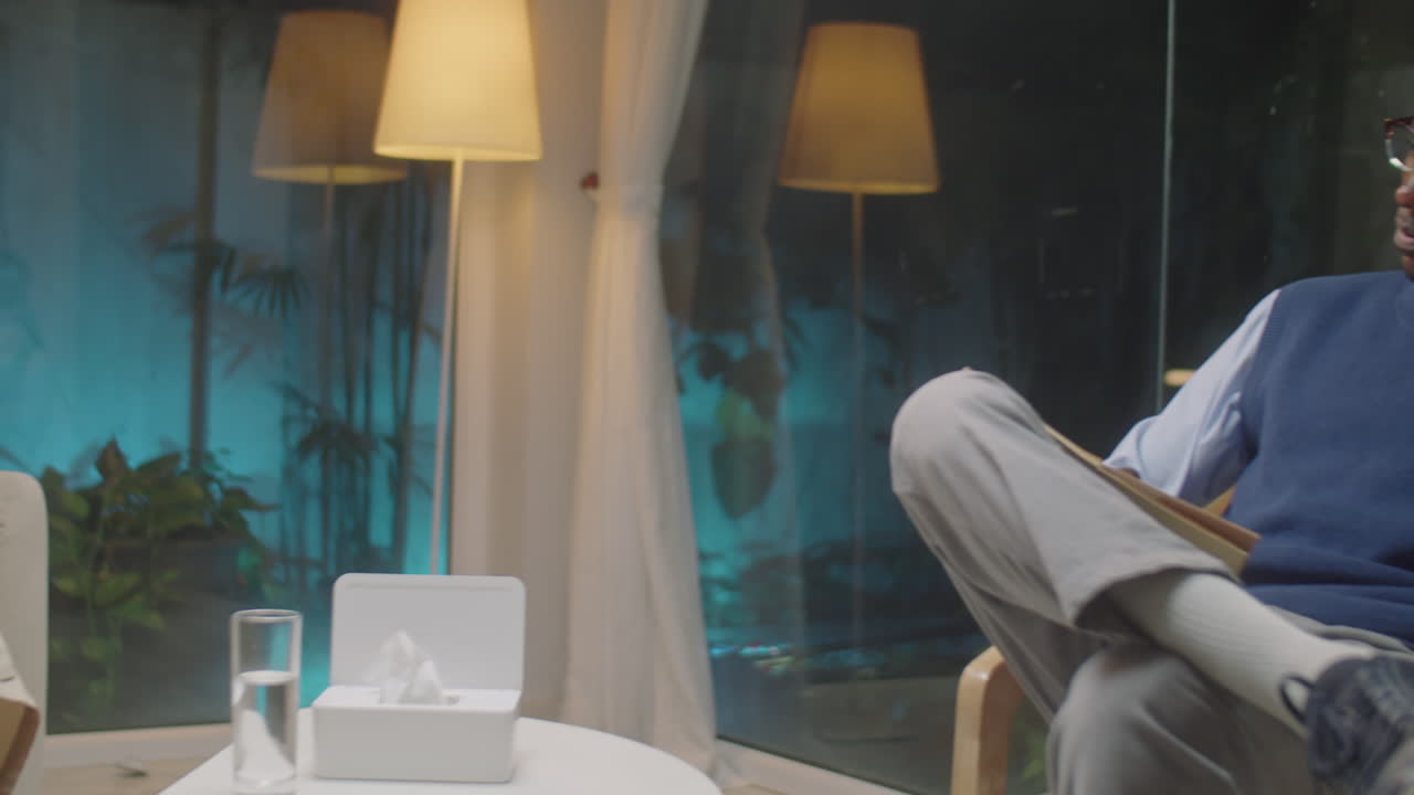 Female Patient Speaking to Psychologist during Therapy Session