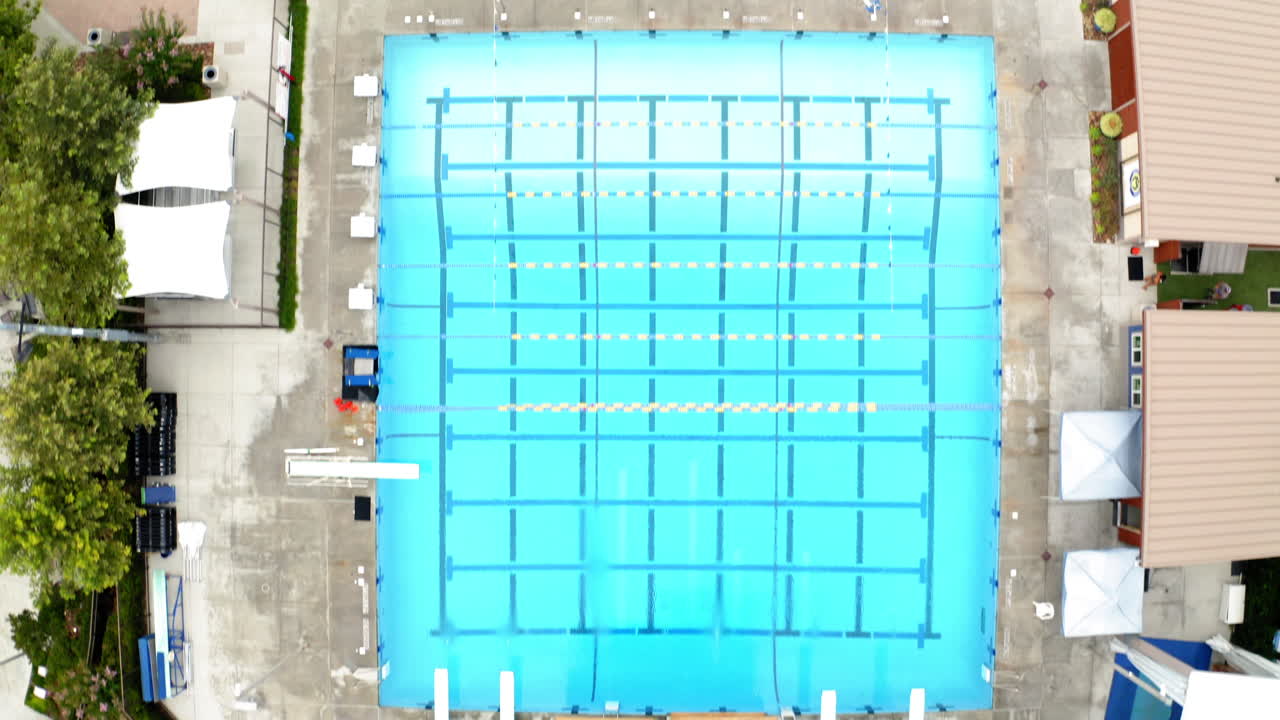 Aerial View of an Empty Swimming Pool with Diving Boards