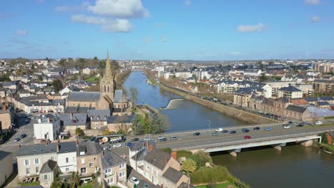 Basilica-of-Notre-Dame-d'Avesnières,-riverside-and-bridge