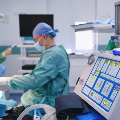 doctor starts the surgery. group of specialists doing a surgery in the modern operating room. innovative equipment in hospital.