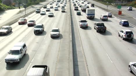 traffic moves slowly along a busy freeway in los angeles 18