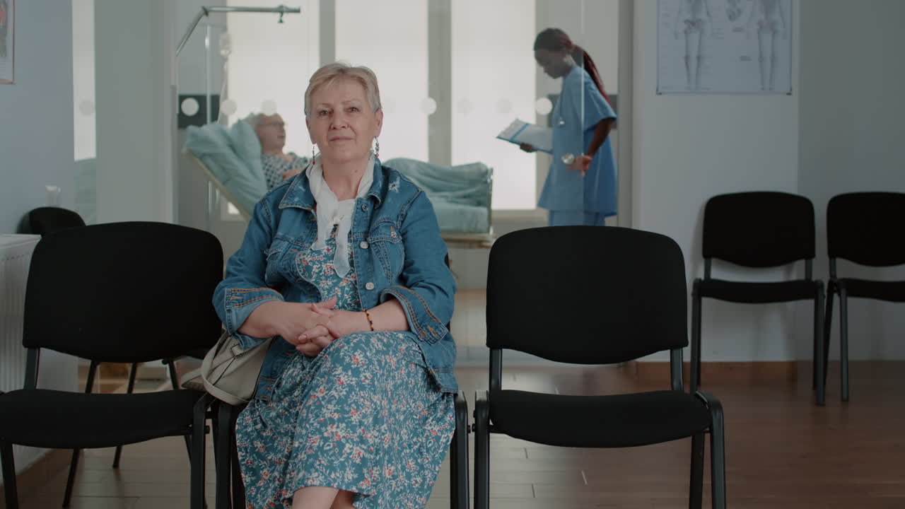 Portrait of senior patient sitting in waiting room area