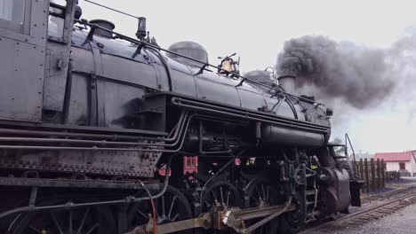 Close-up-of-a-Steam-Locomotive-Warning-Up-on-a-Side-Spur-on-a-Cloudy-Day