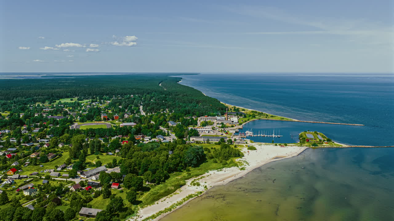 Coastal village hyperlapse with ocean view and lush green landscape