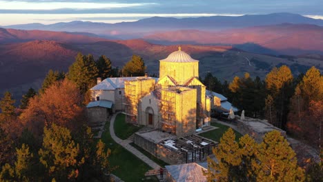 repair works on monastery djurdjevi stupovi, serbia at sunset