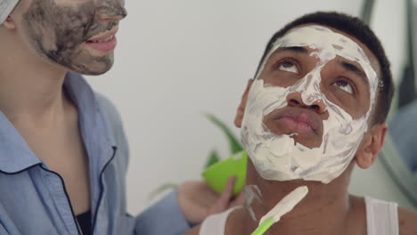 portrait of a black male having scrub applied