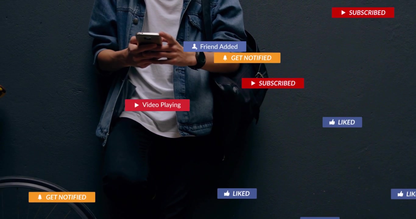 Man tapping phone by gray wall, causing social media badges clustering, fading and driving likes