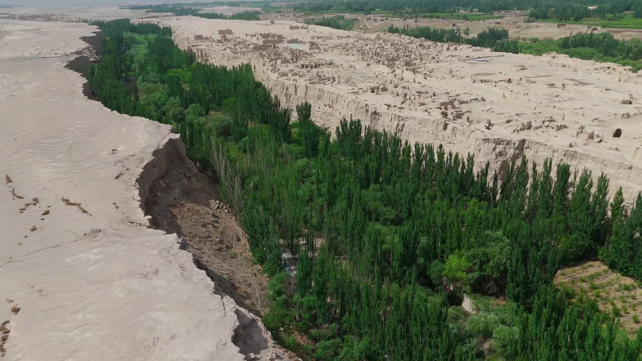 Aerial Drone Flyover of Yarghul, Jiaohe Ruins, Historic Fortress City in Xinjiang Desert