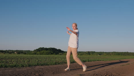 woman dancing in a field