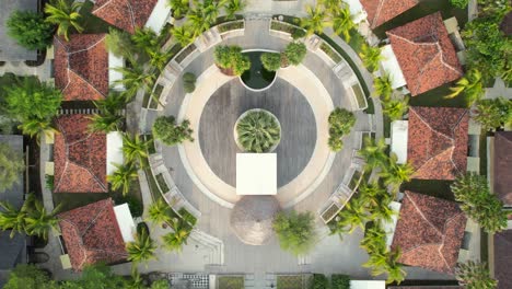 frii resort in gili trawangan, lombok, indonesia - top down aerial ascending over complex of small rental villas built around common circular lounge area