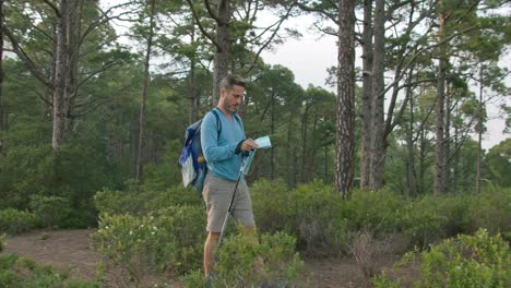 male traveler reading map