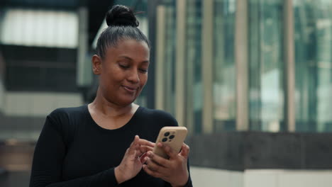 woman using smartphone in urban setting
