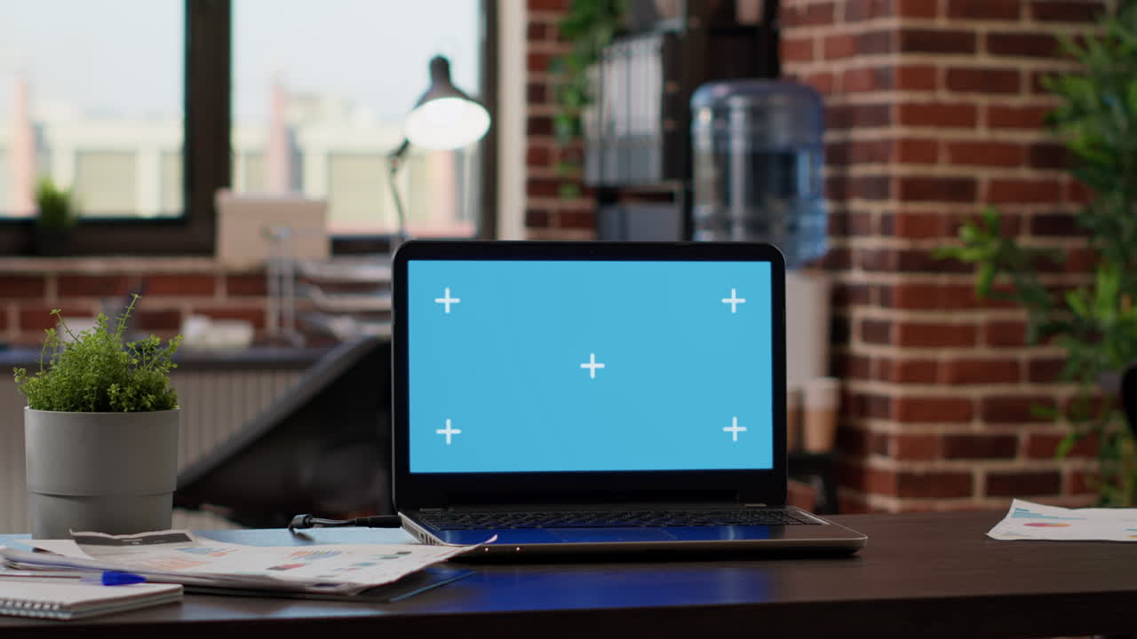No people in empty startup office with greenscreen on laptop
