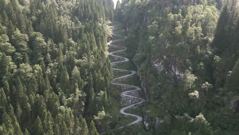 Drone-Shot-of-Kossdalssvingene-from-Far-Away-closing-in-on-the-17-hairpin-turns-in-Osterøy,-Norway