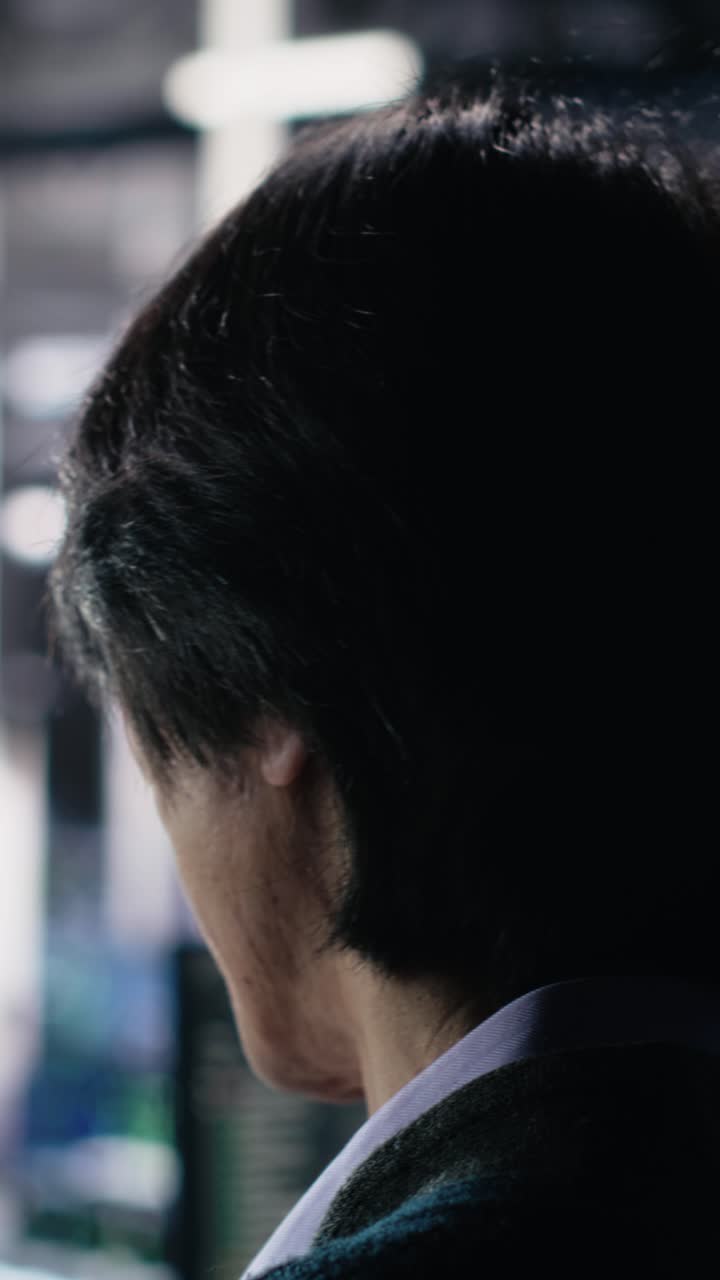 Vertical video Software developer in data center coding with generative AI