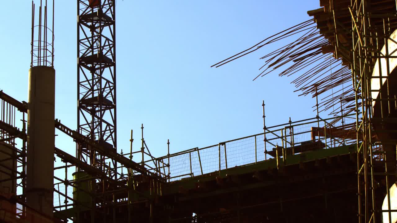 Time lapse of crane and building construction site