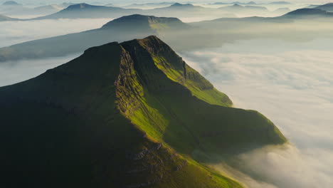 Green Mountains Emerging From a Sea of Clouds