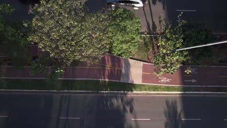 drone view of a bike crossing the frame in a bike lane