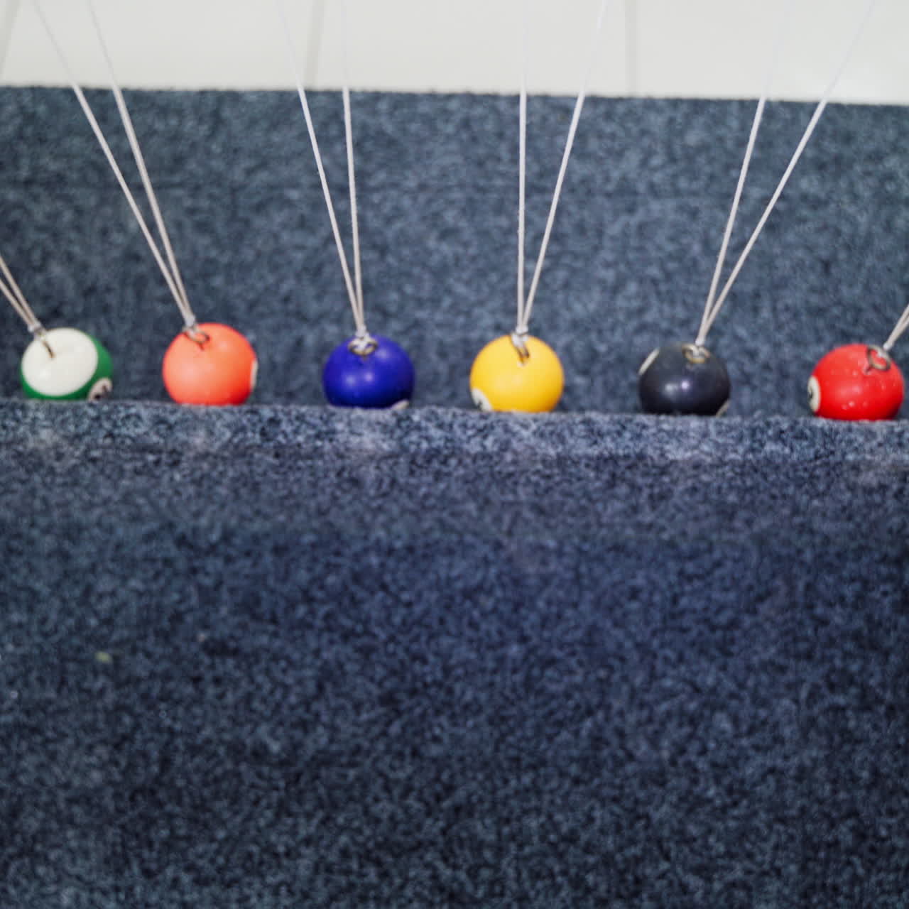 Balancing balls of Newton's cradle. Museum of Science