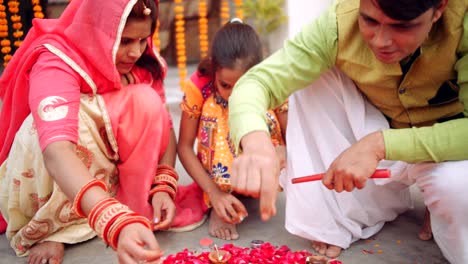 young parents with daughter celebrate decorate for diwali festival