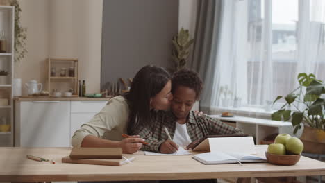 mother helping child with homework