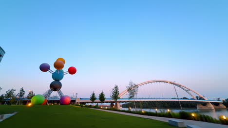 contemporary art installation on the green lawn near the danube. view on the appolo bridge in bratislava, slovakia