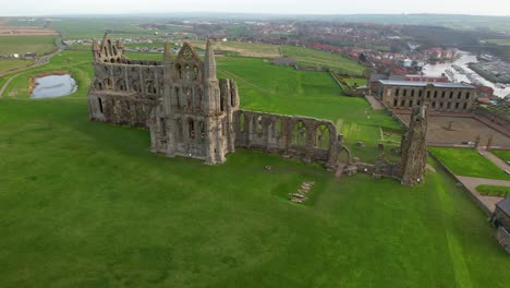 abbey ruins and cholmley house or whitby hall with stone garden, whitby in england