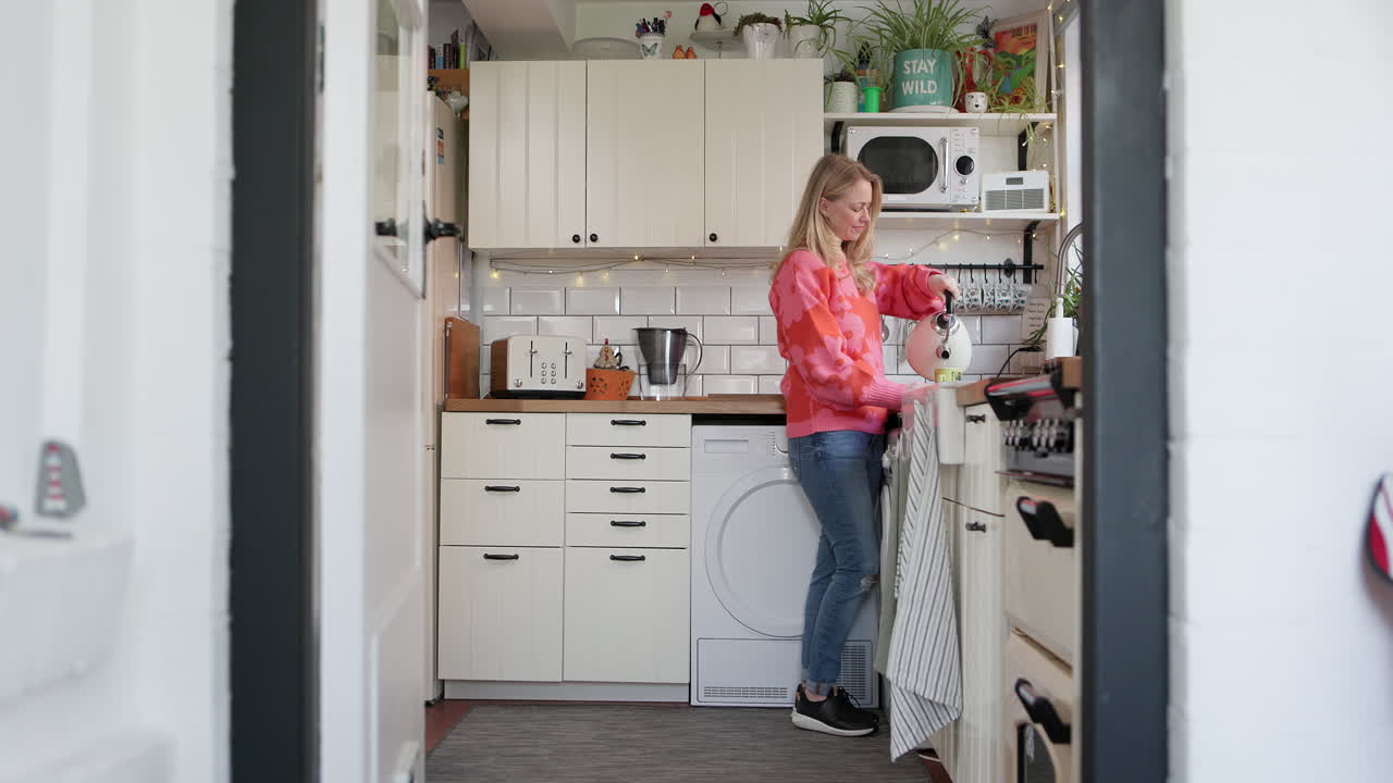 A woman in her kitchen