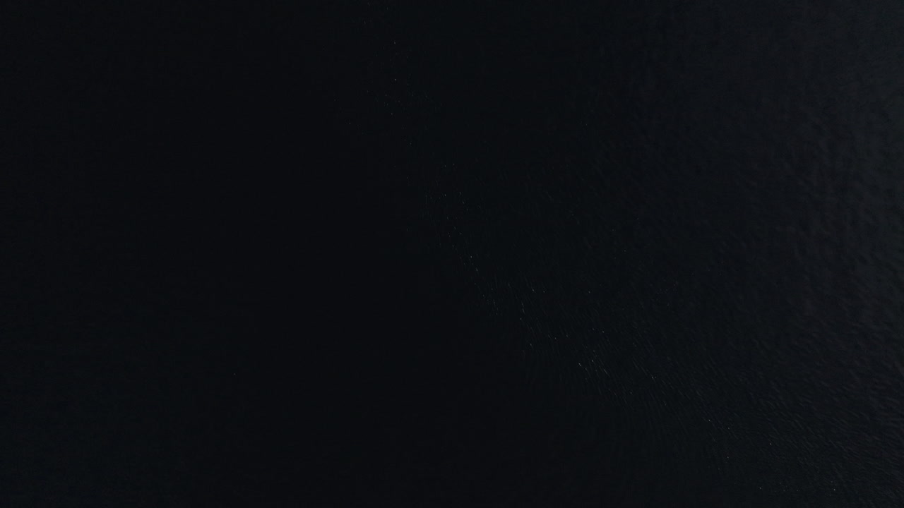 Tilting drone shot revealing the beautiful city of Bergen, Norway on a sunny winter day